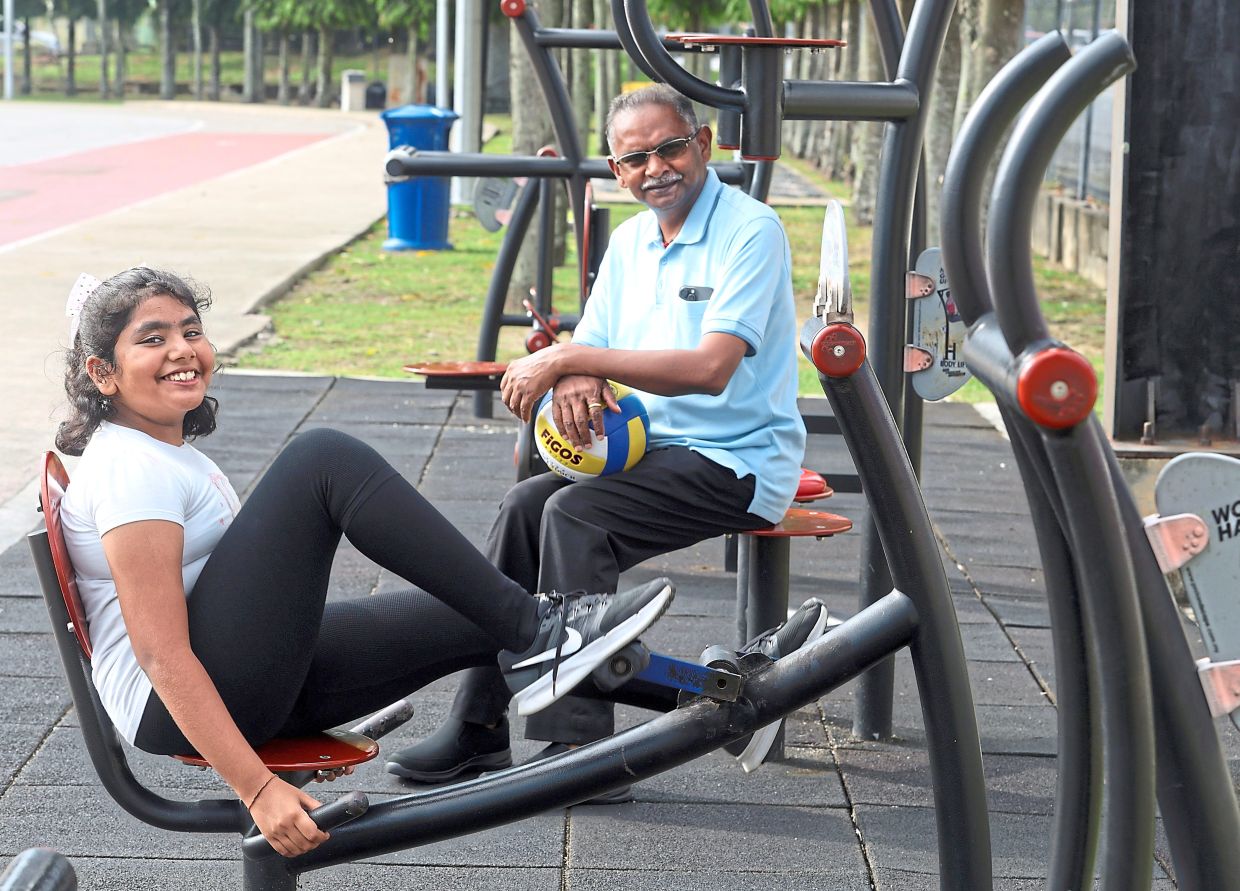 Manimaran ensures Srinisha receives his undivided attention since the passing of the girl’s mother. — CHAN TAK KONG/The Star
