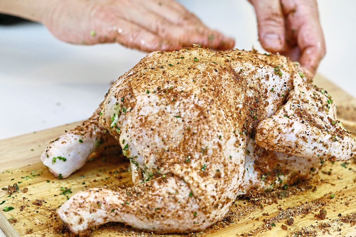 Coat chicken with a dry rub of brown sugar, paprika, cayenne pepper, English mustard powder, salt and black pepper.