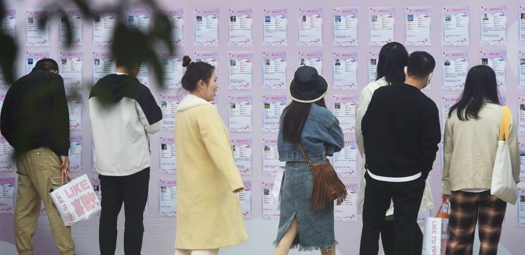 People view information about single men and women at a pre-blind dating event in eastern China. -- Photo: Getty Images / SCMP