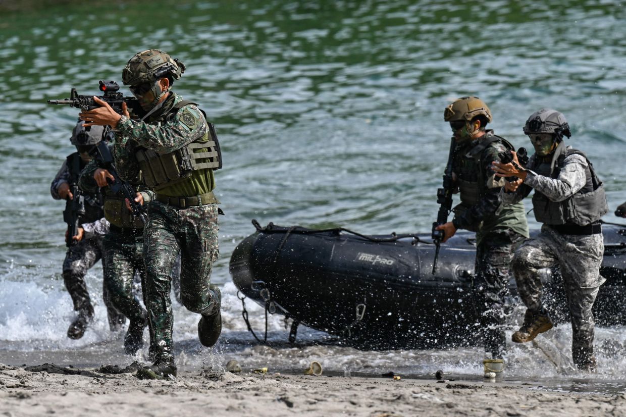 Philippine and South Korean troops participate in an amphibious raid military exercise at the Marines training base in Ternate, Cavite province, west of Manila, on Saturday, June 20, 2026, as part of the annual Philippines-US joint Marines exercise dubbed Kamandag (Venom). -- Photo by Jam STA ROSA / AFP