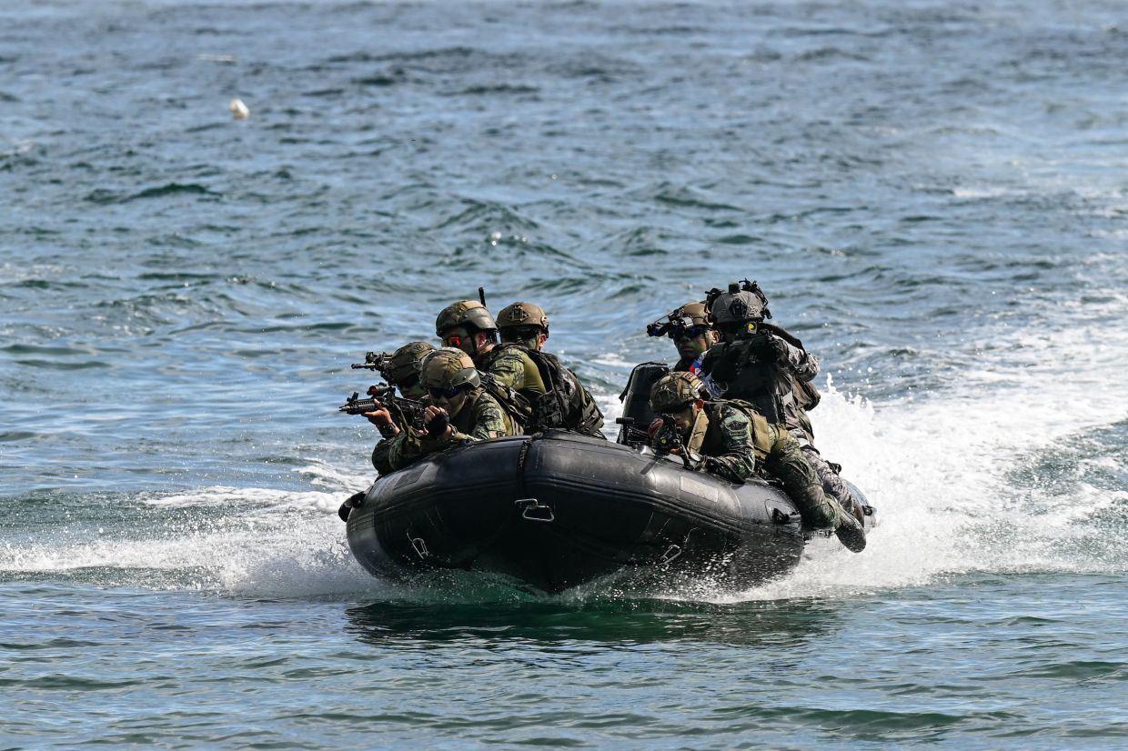 Philippine and South Korean troops participate in an amphibious raid military exercise at the Marines training base in Ternate, Cavite province, west of Manila, on Saturday, June 20, 2026, as part of the annual Philippines-US joint Marines exercise dubbed Kamandag (Venom). -- Photo by Jam STA ROSA / AFP