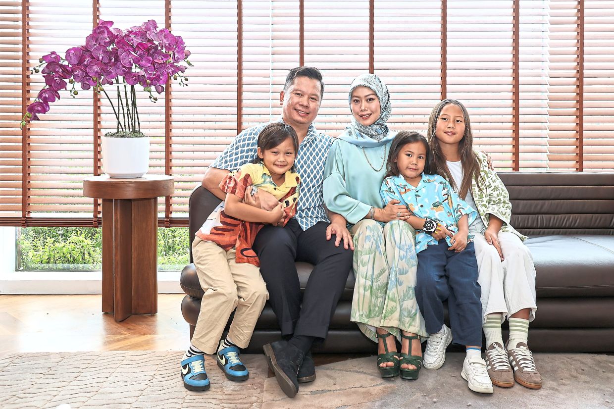 Najib is a workaholic, but credits his wife Qistina with steadying him as a father and business owner. From left: Arman, Najib, Qistina, Arif and Arya.