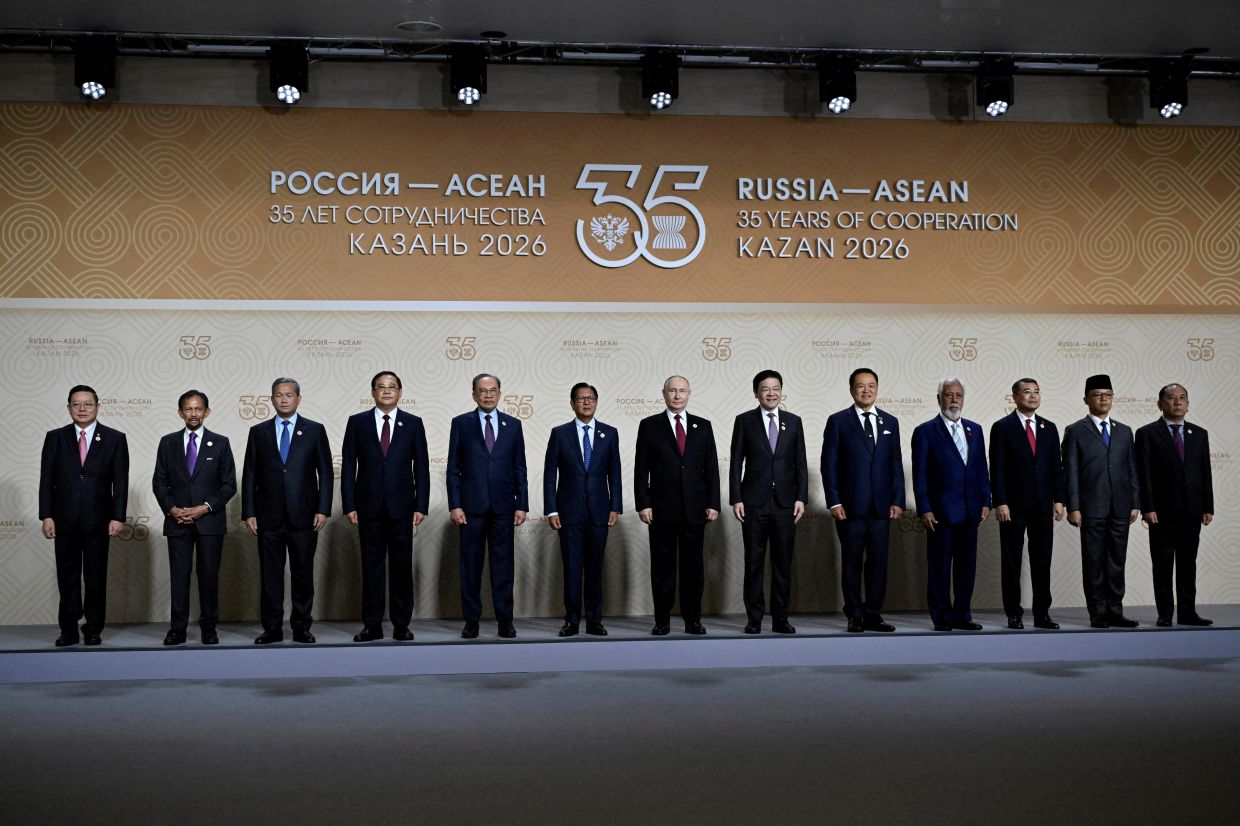 Association of Southeast Asian Nations (ASEAN) Secretary General Kao Kim Hourn, Brunei's Sultan Hassanal Bolkiah, Cambodia's Prime Minister Hun Manet, Laos' Prime Minister Sonexay Siphandone, Malaysia's Prime Minister Datuk Seri Anwar Ibrahim, Philippine President Ferdinand Marcos Jr., Russia's President Vladimir Putin, Singapore's Prime Minister Lawrence Wong, Thailand's Prime Minister Anutin Charnvirakul, East Timor's Prime Minister Xanana Gusmao, Vietnam's Prime Minister Le Minh Hung, Indonesian Foreign Minister Sugiono and Myanmar's Permanent Secretary of the Ministry of Foreign Affairs U Hau Khan Sum pose for a family photo of the Russia-ASEAN summit, which commemorates 35 years of collaboration between Russia and the ASEAN countries, in Kazan, Russia . -- Photo: Alexander Nemenov/REUTERS