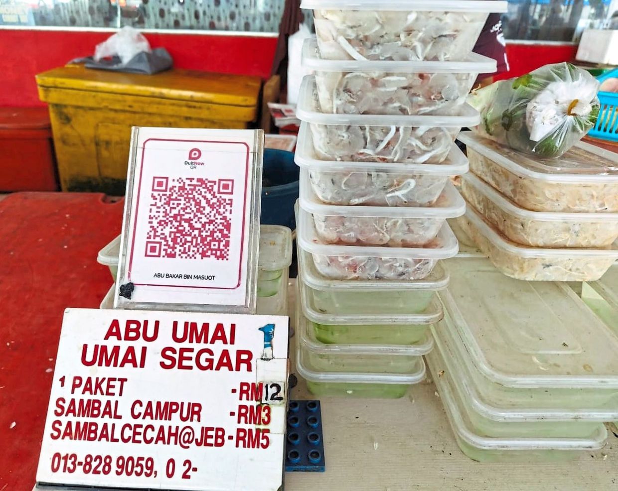 Abu Bakar's umai ready for sale at his stall at the Mukah wet market.