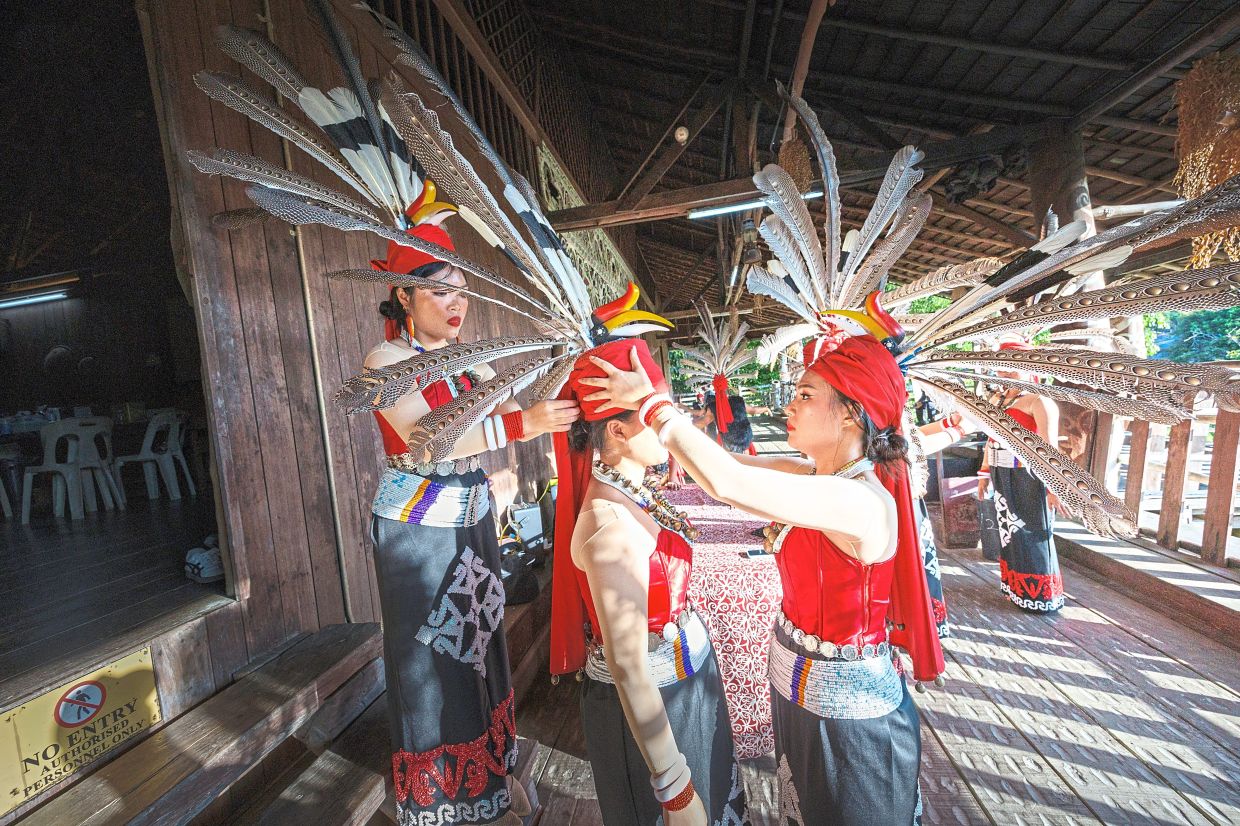 Members of the Sarawak Tagal (Okolod) Association getting ready for a cultural performance at the Sarawak Harvest and Folklore Festival.