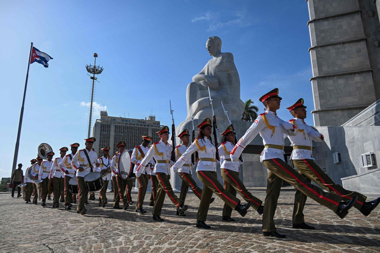 Cuban soldiers take part in a wreath-laying ceremony led by Vietnam's Minister of Foreign Affairs, Le Hoai Trung (out of frame), at the José Martí monument in the Revolution Square, in Havana, on Monday, June 22, 2026. -- Photo by YAMIL LAGE / AFP