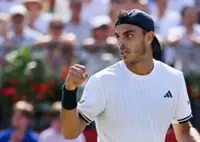 Tennis-Cerundolo battles past Paul to win Queen's title