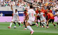 Soccer-Iran coach says unbeaten World Cup start will be remembered in history