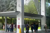 Over 100 migrant workers in Singapore turn up at the Manpower office claiming unpaid wages; ministry probing two firms