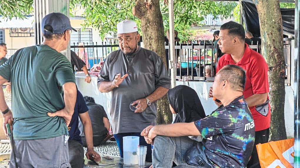 Ahmad Akhir (white cap) credits his upbringing in Taman Dato Harun in shaping his view on unity.
