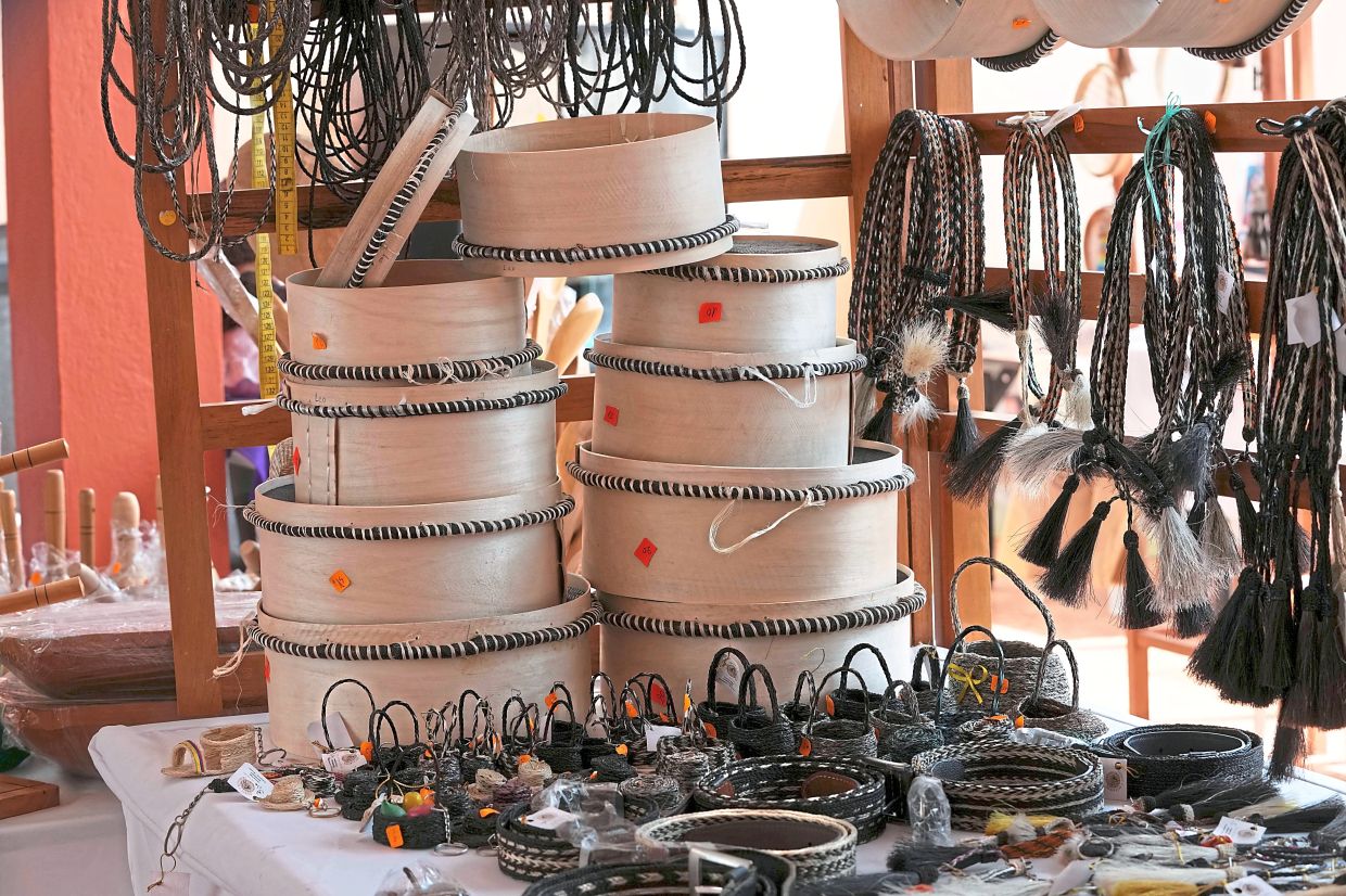 Woven horsehair sieves on display.