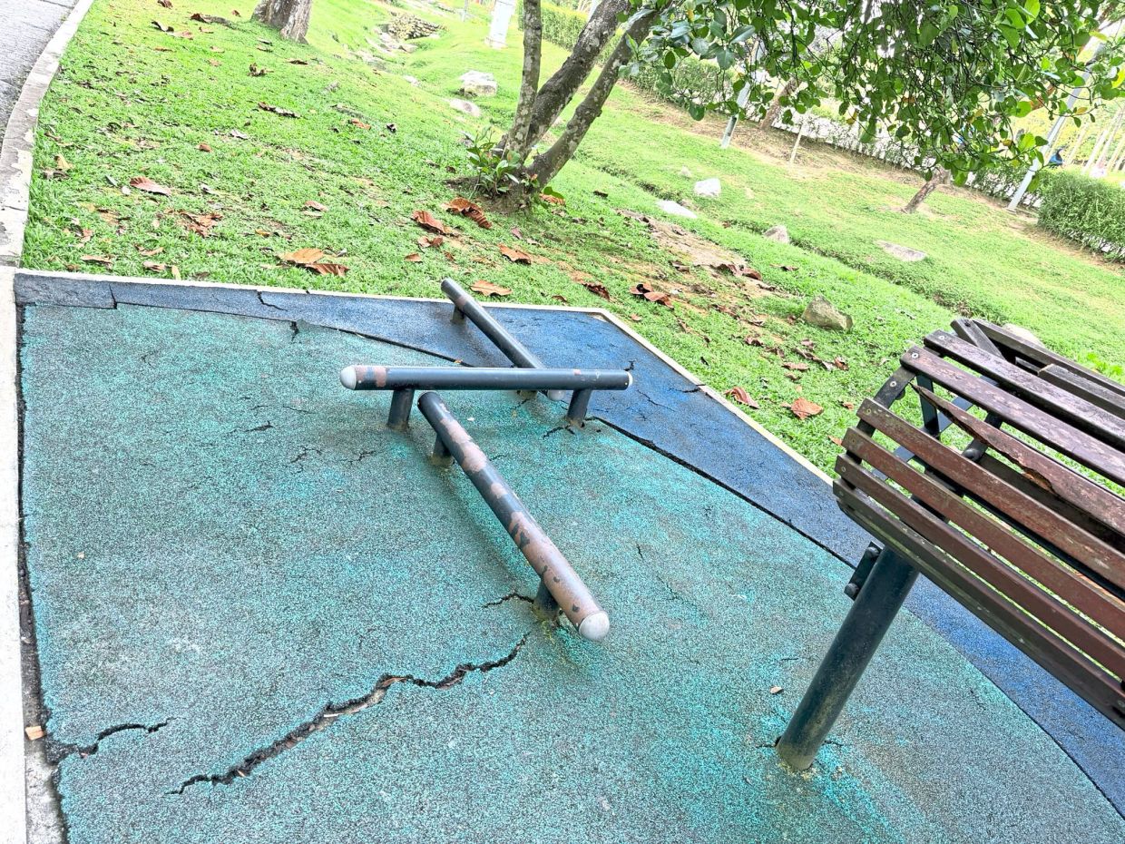 The slippery and worn-out flooring at the workout station in Taman Persekutuan Bukit Kiara is a safety hazard when it rains.