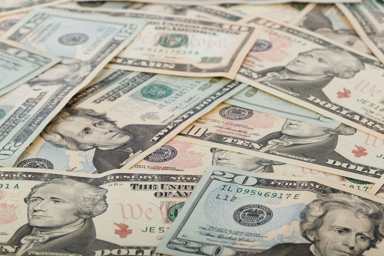 Dollar hits 13-month high as rate-hike bets, stock rout boost demand