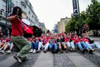 Soccer-No regrets for no-row Norway fan caught sitting still on TV 