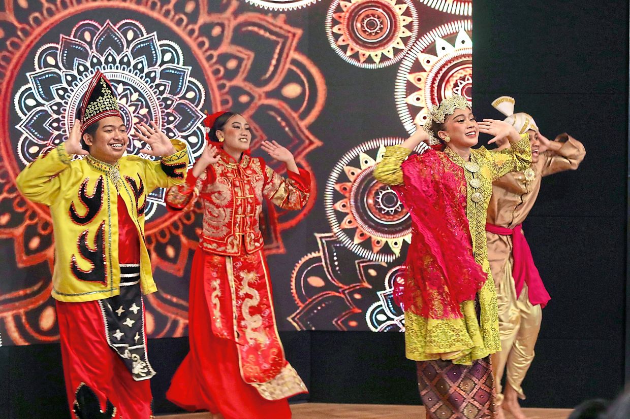 Heritage on display: Cultural performers taking centre stage at Menara Star during the launch of Star Karnival Cuti-Cuti Malaysia 2026, highlighting Malaysia’s multicultural identity. — LEONG WAI YEE/The Star