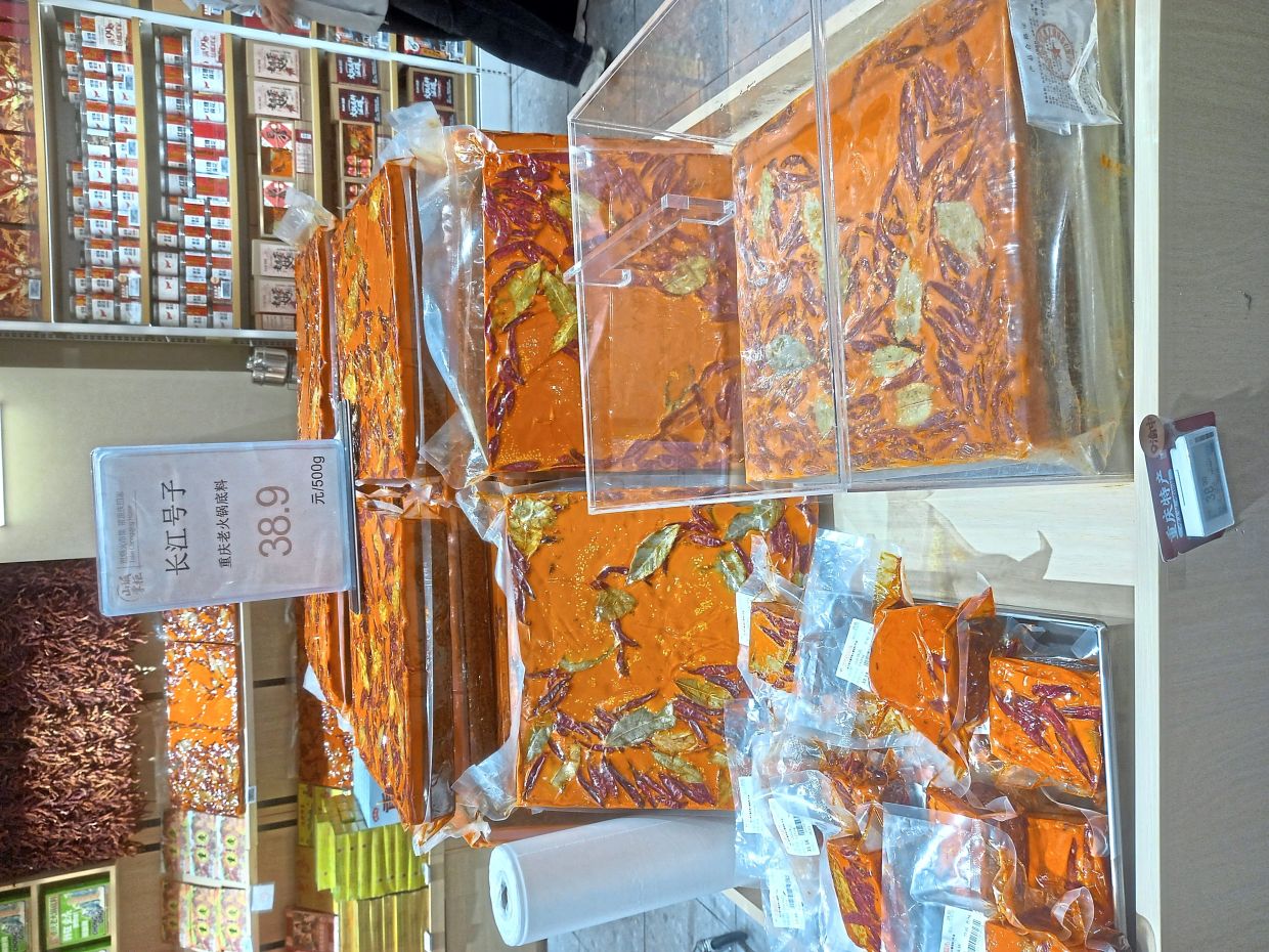 These compressed 'bricks', which are meant to be the base of hotpot meals, is widely sold in Chongqing. — FOO YEE PING/The Star