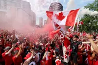 Soccer-Canada fans on the march turn Vancouver into sea of red and white
