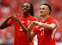 Soccer-Vargas, Manzambi strike as Switzerland top group with 2-1 victory over Canada