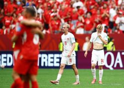 Soccer-Canada suffer rude awakening as Swiss claim Group B top spot