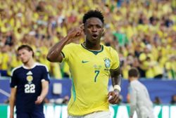 Soccer-Vinicius fires Brazil into World Cup knockouts with 3-0 win over Scotland