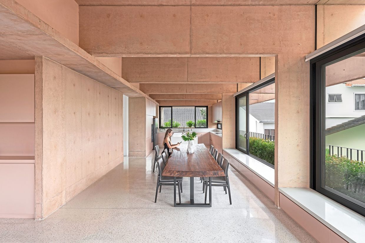 The dining room with its signature pink concrete walls.