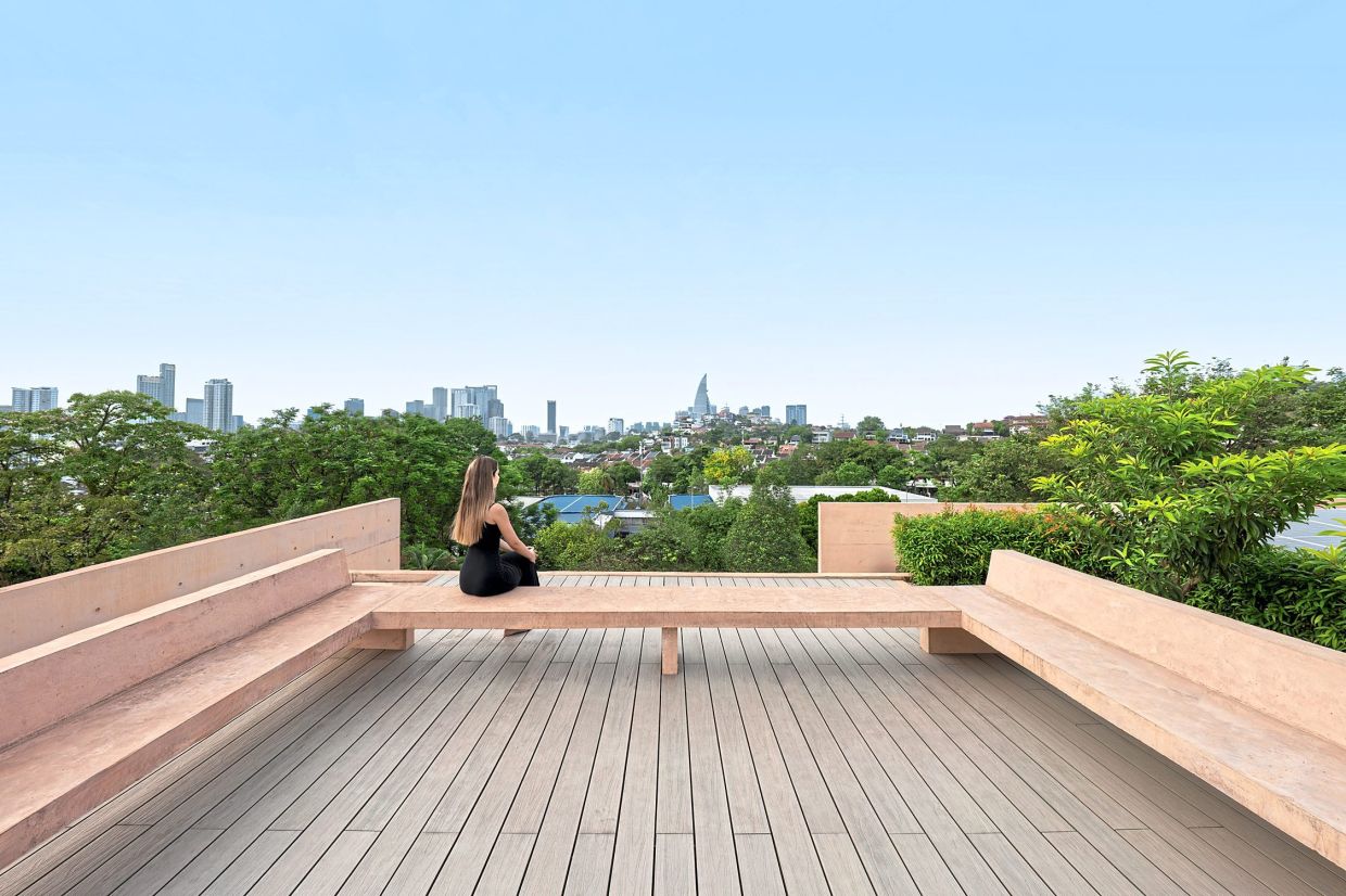 The roof deck offers expansive views of the Kuala Lumpur city skyline.