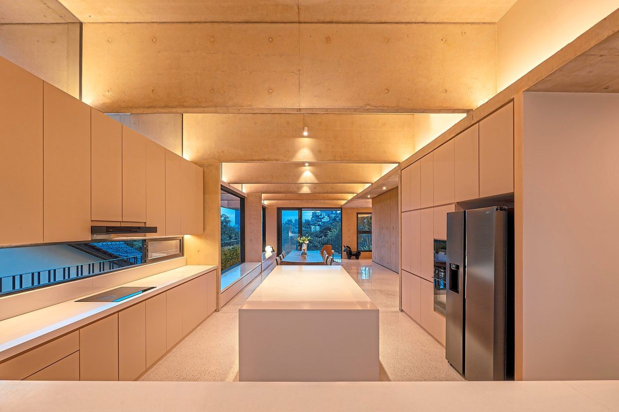 When lit up at night, the kitchen takes on stronger hues than in the daytime.
