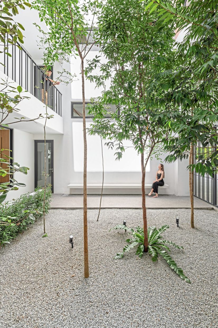 The central courtyard draws natural light into the interior and facilitates cross ventilation.