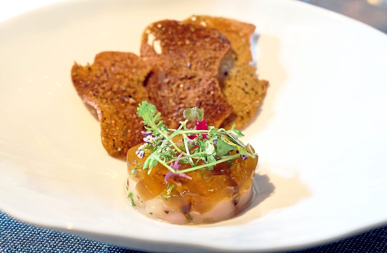 Scallop tartare with seaweed toast and ponzu.