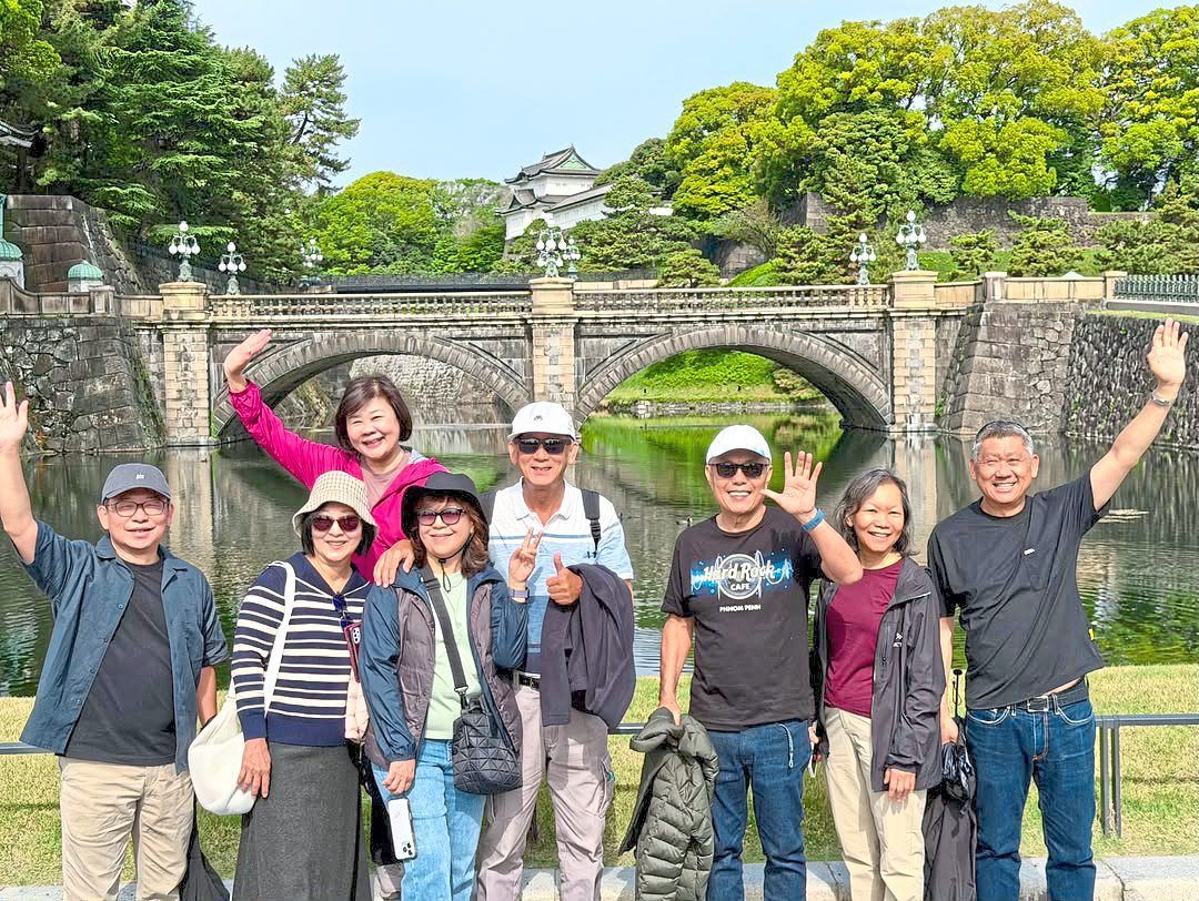 The writer (far right) and his travel buddies at the Nijubashi Bridge in Ginza, Tokyo. From July 1, the international tourist tax for Japan will be ¥3,000 (RM77) per person, up from ¥1,000 (RM26) previously.