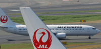 Japan cancels 100 flights as twin storms approach