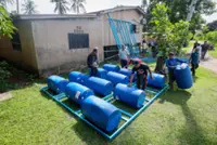 Aid groups build 20 heavy-duty rafts for residents of flood-prone areas in Kelantan