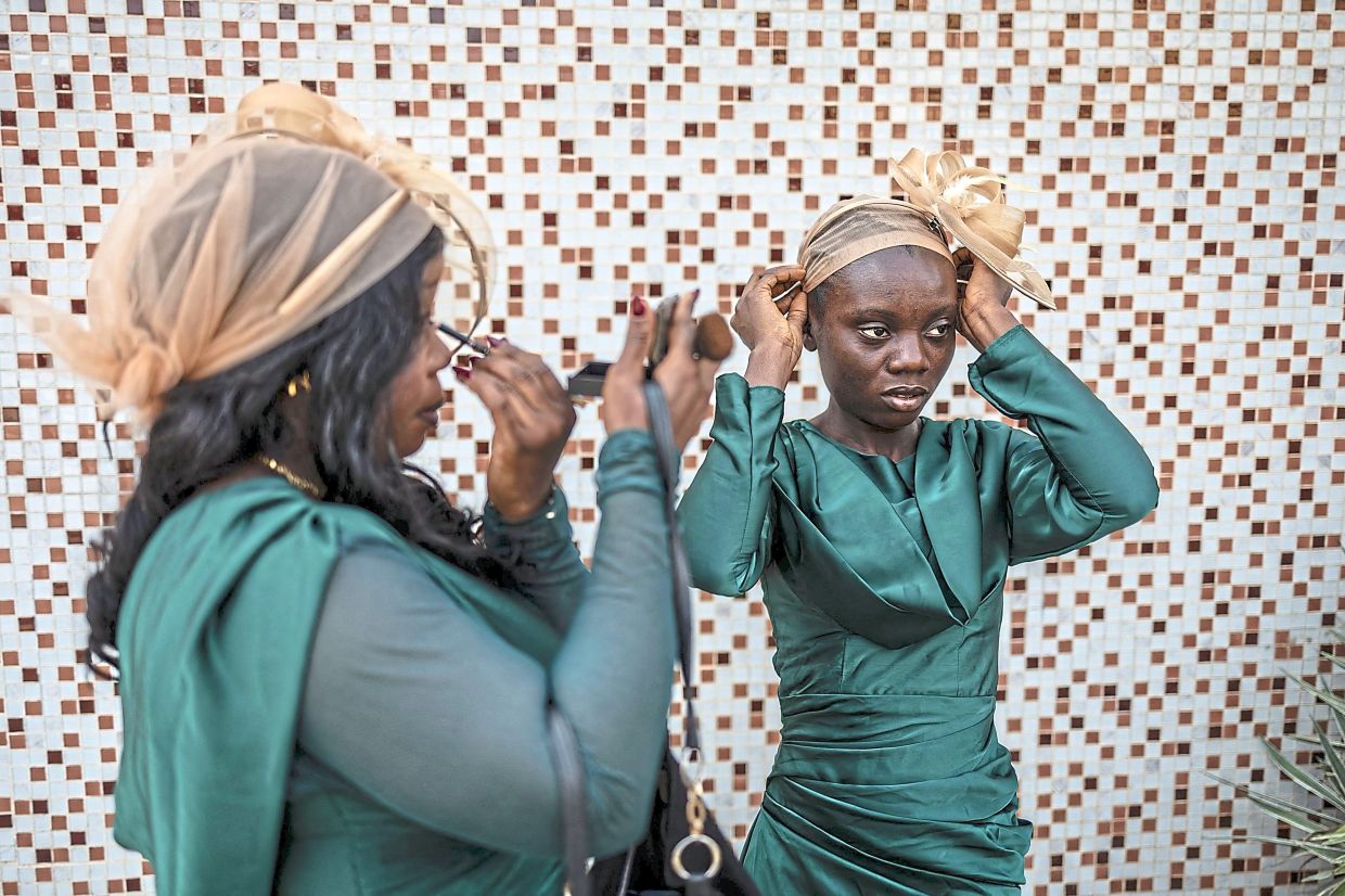 Maids of honour preparing for the wedding ceremony at the Bishop Akinyele Memorial Anglican Church.
