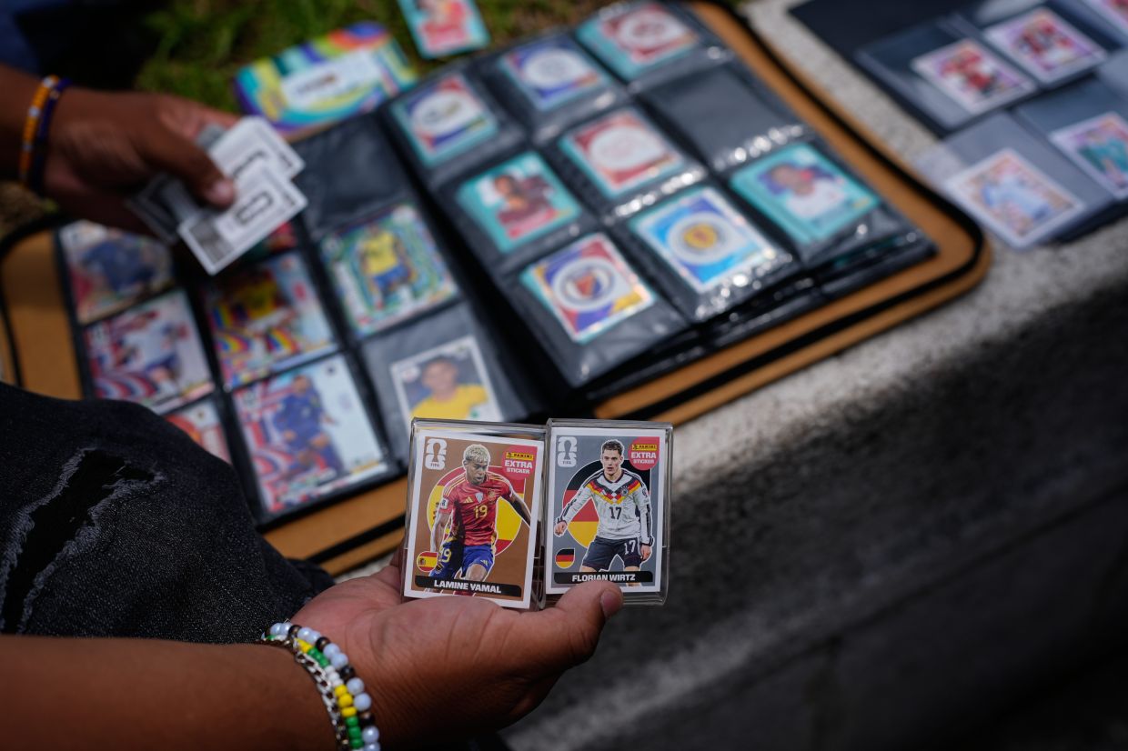 Part of the beauty of the Panini stickers is in their accessibility. Each pack only costs about US$2 (RM8.30). Photo: AP 
