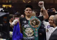 Boxing-Usyk vacates titles before 'last dance'