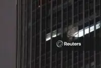 Small aircraft crashes into Beijing's tallest building, eyewitnesses say