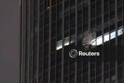 Small aircraft crashes into Beijing's tallest building, eyewitnesses say