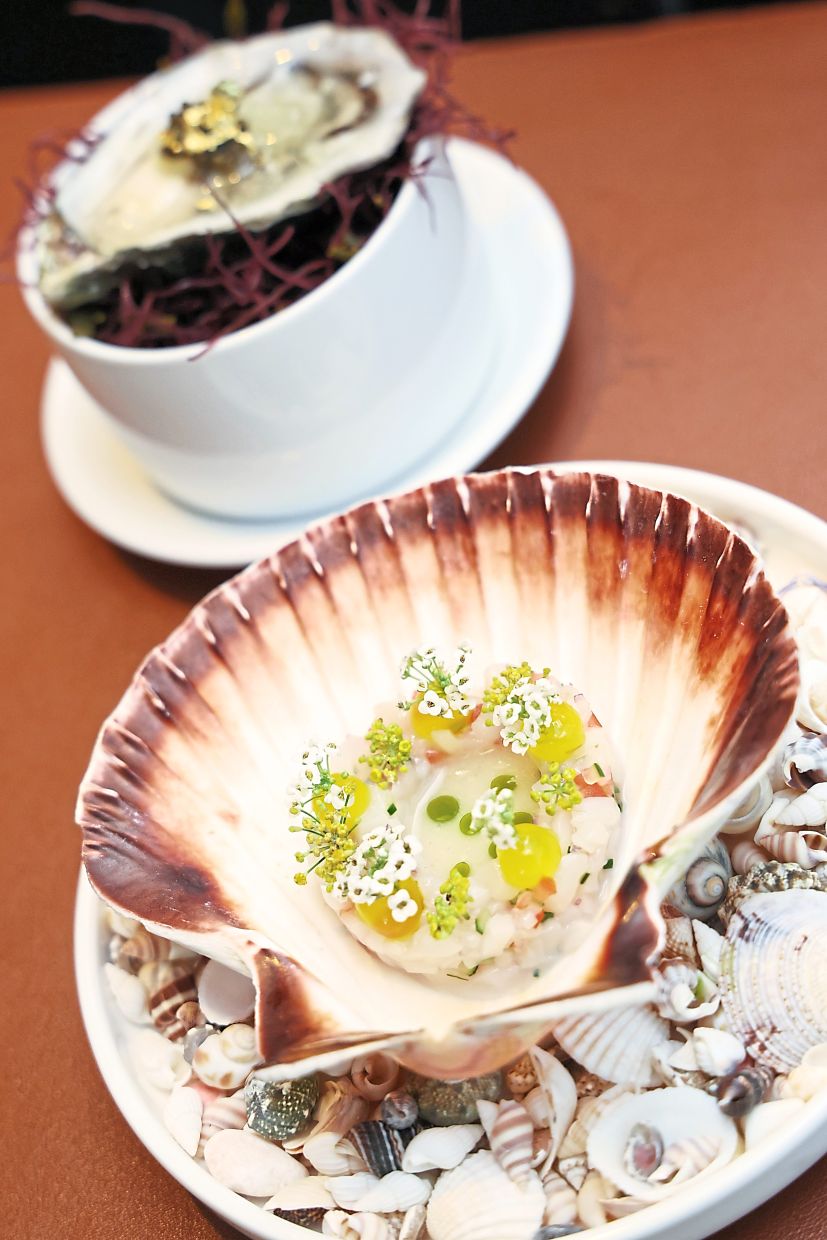 Left: The menu features an amuse-bouche duet of scallop tartare (top) and a Fine de Claire oyster.