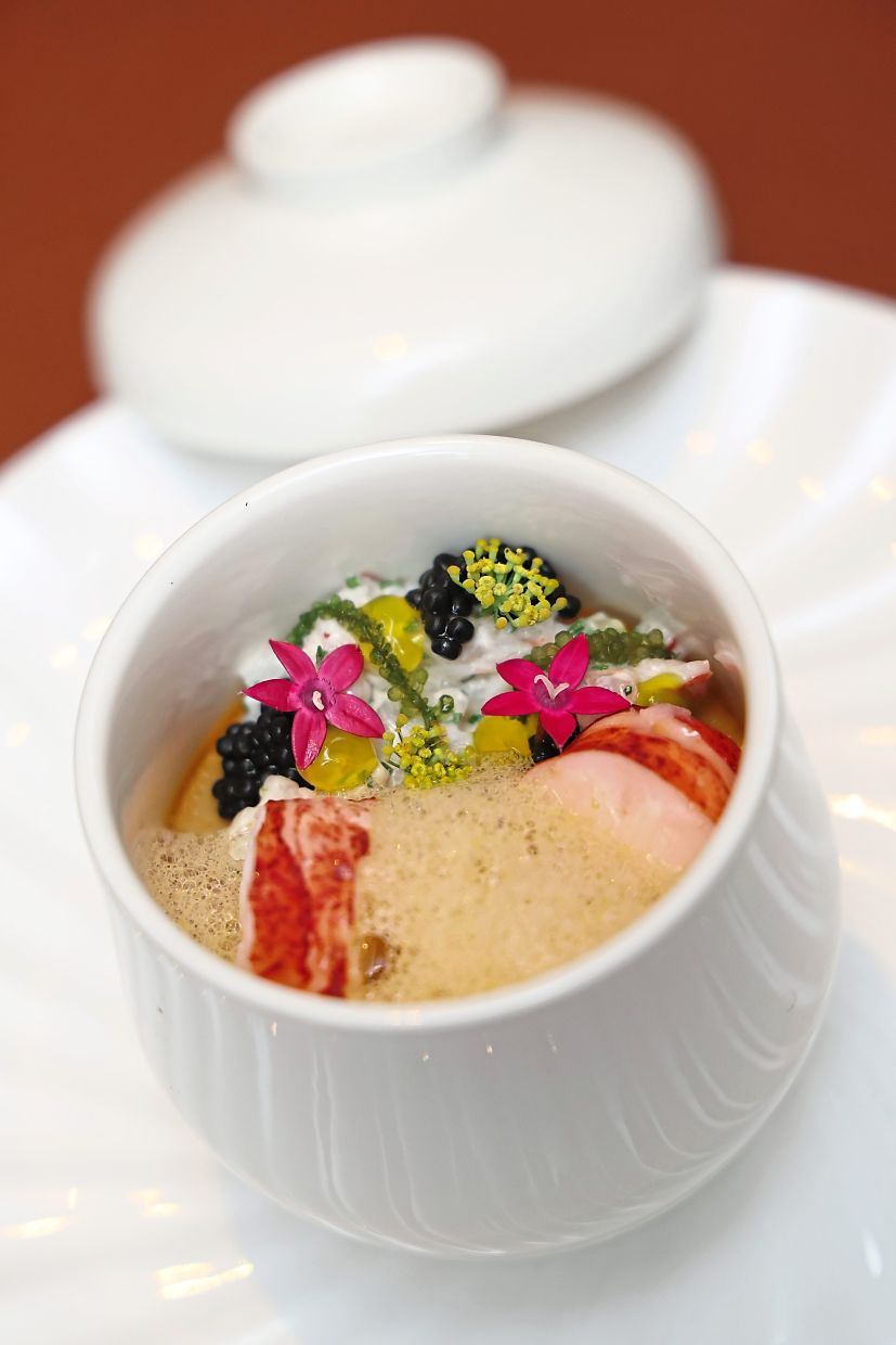 Royale Custard, introduced in 2018, features sliced Boston lobster tail in a velvety crustacean emulsion that delivers a burst of savouriness. — GLENN GUAN/The Star