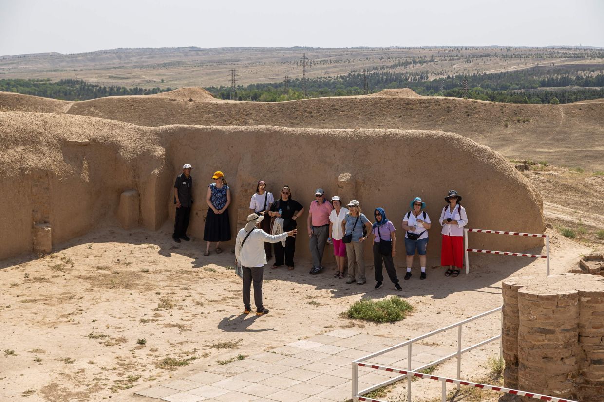 Tourists with their guide at Nisa. Foreign leisure visitors are not allowed to enter Turkimenistan without a guide.