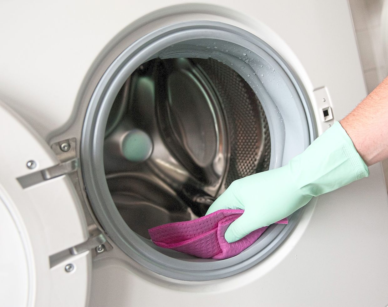 Moisture and residue trapped in the rubber seal of your washing machine can lead to mould and unpleasant smells that transfer to clean clothes. — SONYA SCHONBERGER/dpa