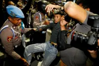 Indonesia police charge four after anti-government protest