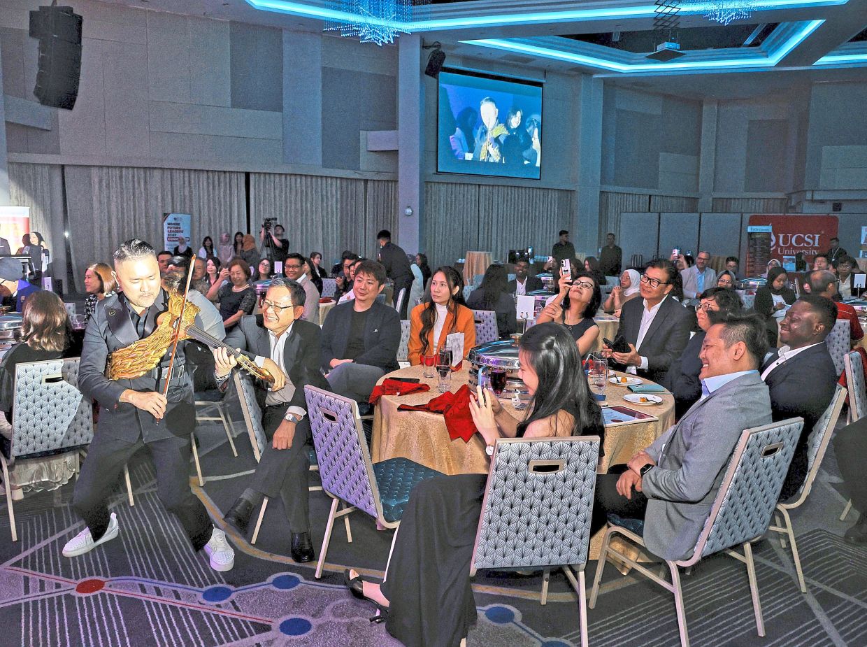 Lau (above) and Bello (below) entertaining guests during the event held in Kuala Lumpur. 