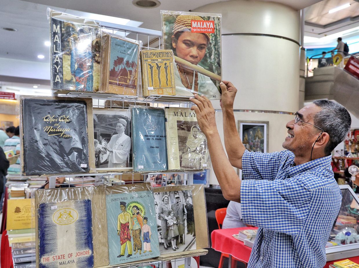Tajuddin, a vintage bookseller and heritage guide, has turned his love of books and history into a life's work. He is a familiar face at the BookStreet events, which specialise in rare books and out-of-print titles. Photo: The Star/Muhamad Shahril Rosli