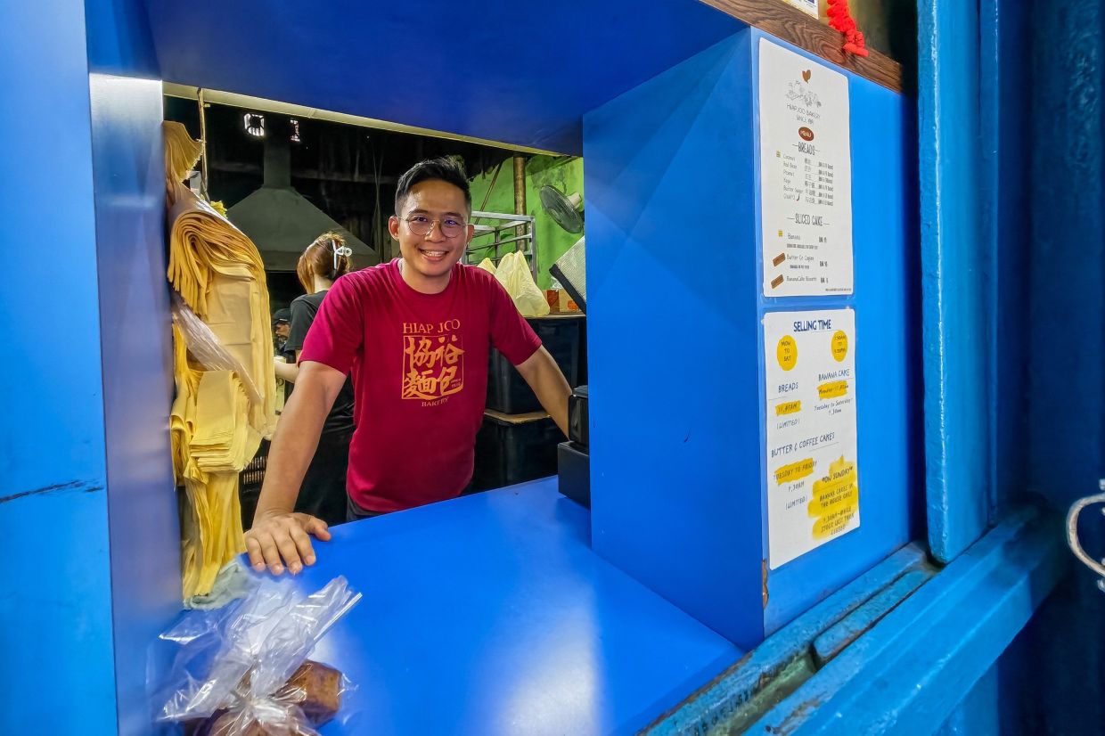 Joseph Lim Toh Hui, 38, oversees the sale of freshly baked bread from the wood-fired oven.