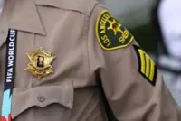 Soccer-Police, firefighters proudly wear World Cup badges as they provide security