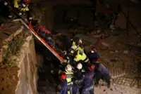 Between silence and shouts, rescuers dig for Venezuela twin quake survivors
