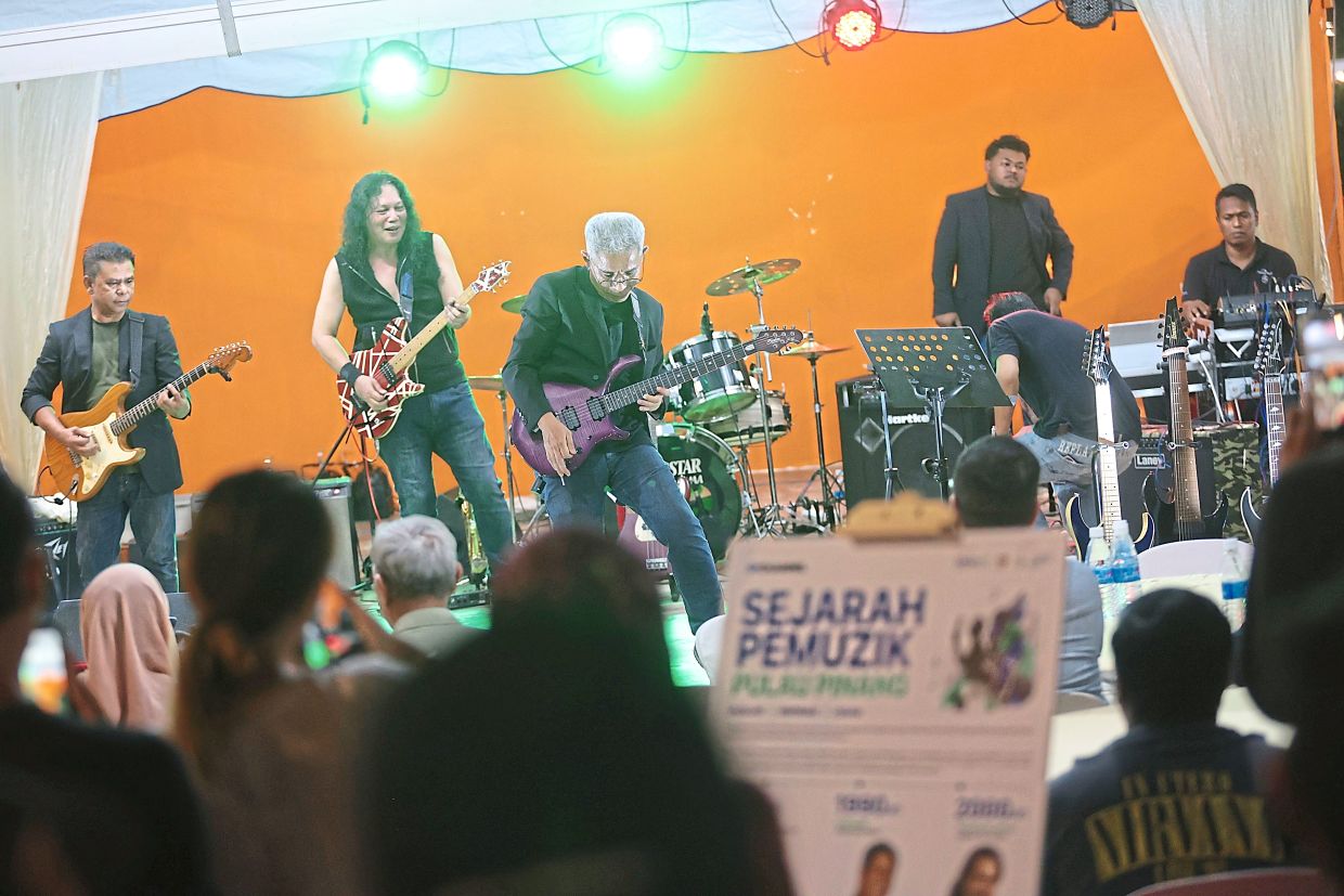 Respected guitarists (from left) known by their stage names Mie Cobra, Megat Arena and Haider Mutiara showcasing their guitar-playing skills at the festival.