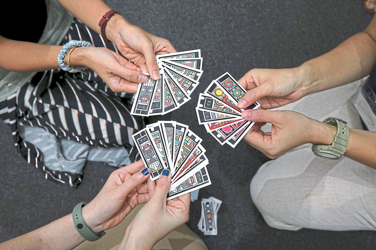The revamped Cherki cards feature vibrant colours and contemporary illustrations while retaining traditional Peranakan motifs and symbols.
