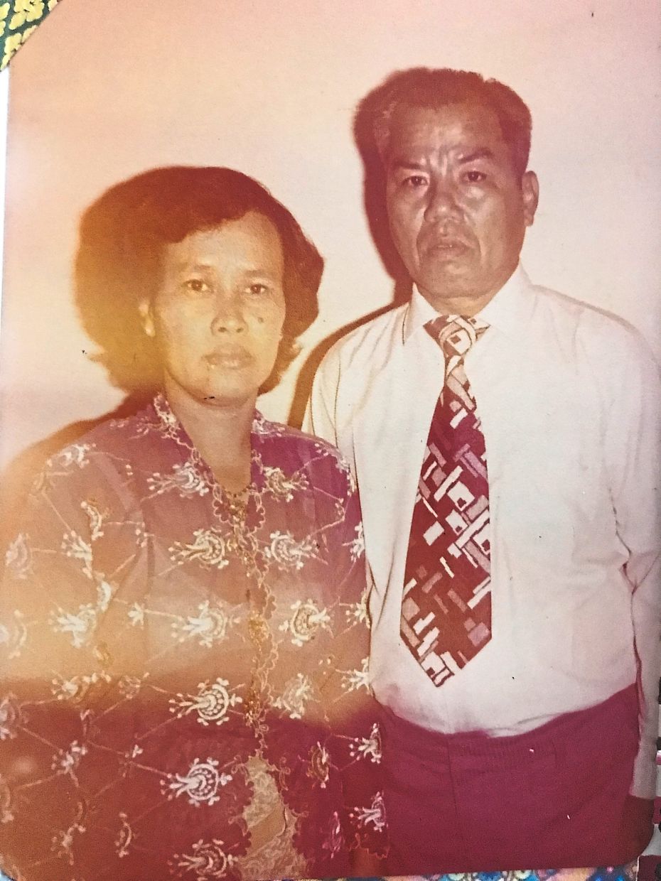 Swee Lin and Swee May learnt much of their Peranakan heritage from their grandmother Deo (left), pictured here with her husband, Tan Kwong Seng. Photo: Lee Swee Lin